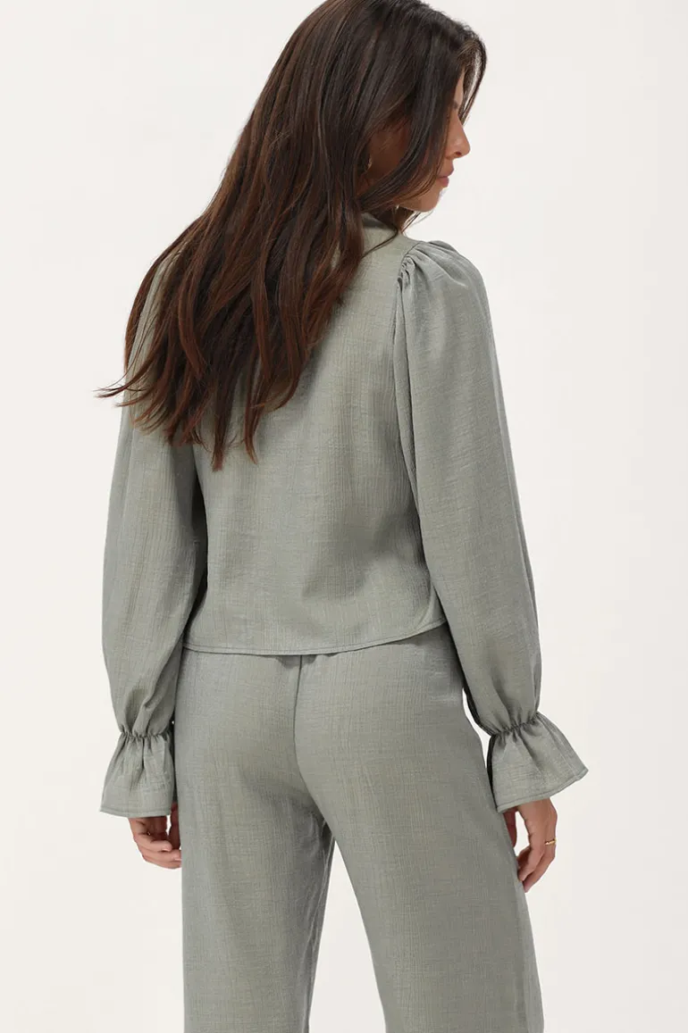 Blouse Verte Brillante Avec Nœuds Et Manches à Volants